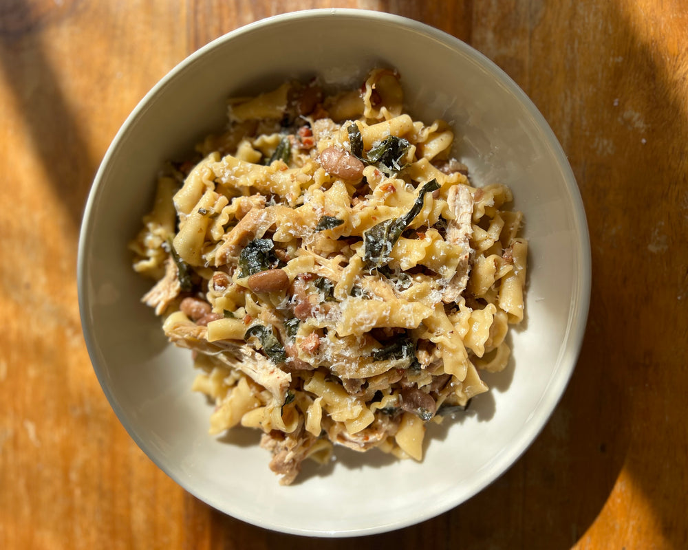 Campanelle with Bayo Beans, Braised Chicken, Buttery Collards, Bacon + Cheddar